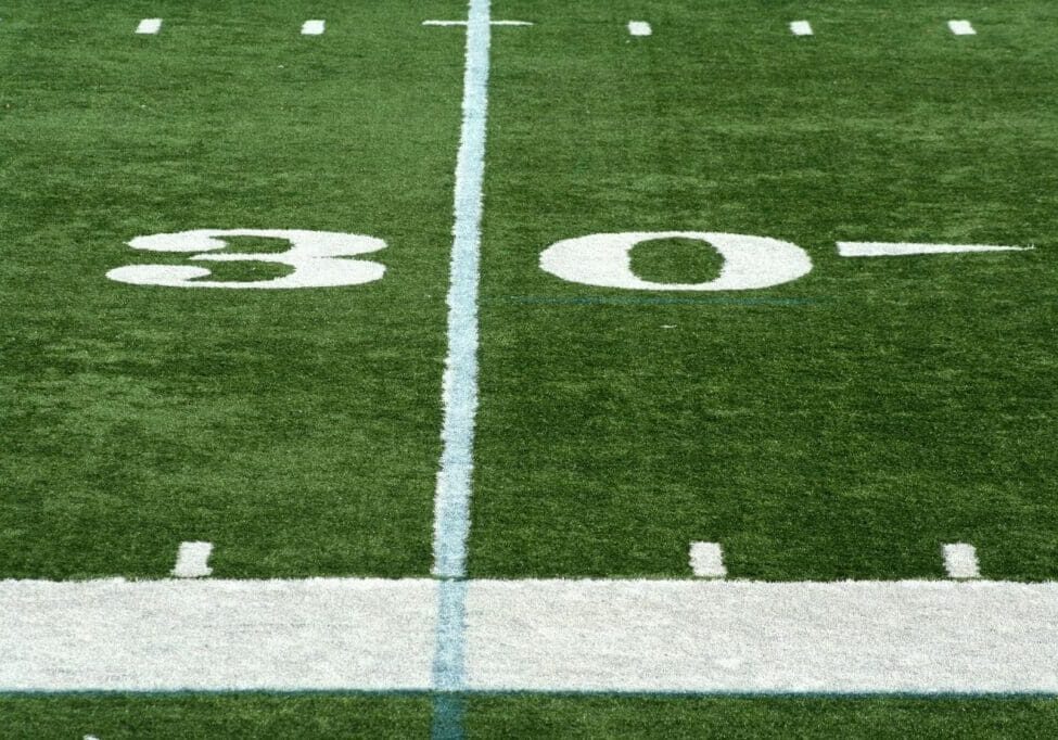 Football field with 30-yard line visible.