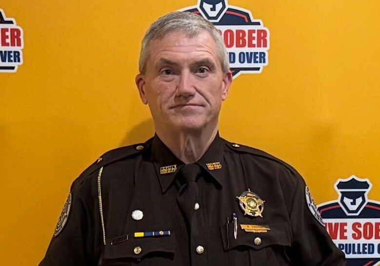 Uniformed officer at "Drive Sober" event.